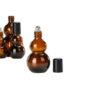 Botellas de Vidrio Ámbar Redondas de 30 ml y 50 ml con Forma de Calabaza para Perfume, con Bolas de Rodillo de Acero Inoxidable, 1 oz 50 ml - Product Image 2