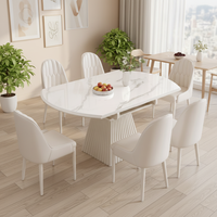 Table à manger ovale extensible moderne en gros, plateau en cuir, pieds en acier, meuble idéal pour gagner de la place dans les petits appartements