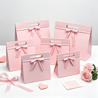 Boîte cadeau triangulaire de luxe personnalisée avec nœud rose, fermeture magnétique, emballage rigide pliable