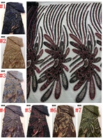 Tissu en dentelle brodé de perles et de paillettes, prix usine Chine, collection 2026, idéal pour mariages et célébrations