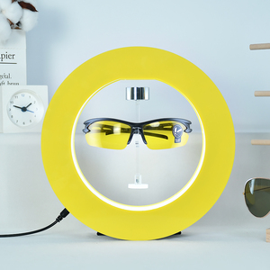 Support d'affichage de lunettes en acrylique flottant magnétique de forme ronde jaune, support rotatif lévitant pour lunettes de soleil, présentoir publicitaire - Product Image 1