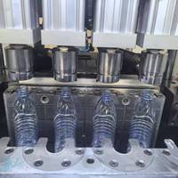 Moules de soufflage manuels pour bouteilles PET, machine de soufflage 380V avec garantie d'un an pour les bouteilles d'eau minérale, de produits chimiques et d'huile alimentaire