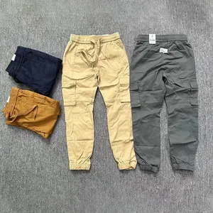 Vente de gros Pantalon de jogging vierge taille moyenne avec cordon de serrage Pantalon chino taille élastique pour enfants Pantalon de jogging confortable pour enfants garçons