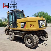 Excavatrice sur pneus d'occasion Caterpillar M315D M312 M317D2 en stock / Machine de terrassement sur roues Cat America originale à vendre