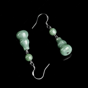 Natural <b>emerald</b> green bean-shaped hoop earrings made of jade bean-shaped stone. Set with S925 silver - Product Image 1
