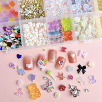 Meilleure vente en vrac 3D Rose fleurs papillon arc perle camélia résine ongles breloques bijoux accessoires Kawaii 24 grille ongles breloques