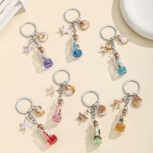 Cute accessory backpack hanger. Dreamy ocean theme. Wish bottle, floating bottle, starfish, shell keychain.