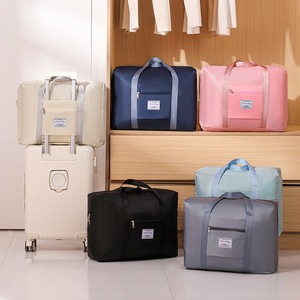 Sac de voyage grande capacité pliable et imperméable avec étui à roulettes pour voyage unisexe beige noir gris bleu marine rose bleu - Product Image 4