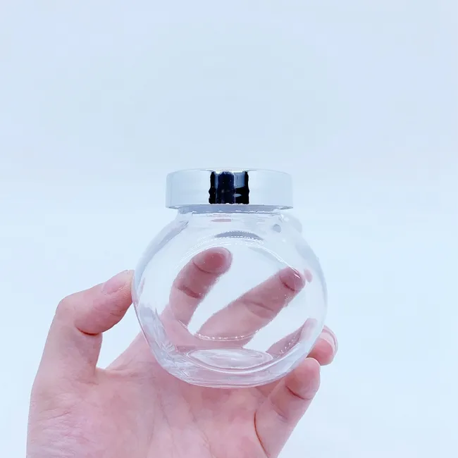 Bocaux sous vide Pot de stockage de nourriture en verre de haute qualité petite bouteille d'emballage de néflier en forme de tambour plat transparent