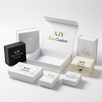 Boîte en carton pliable magnétique blanche avec impression de logo de luxe écologique personnalisée XJY, emballage cadeau