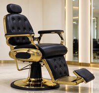 Fauteuil de Barbier de Luxe Noir Capitonnage Boutonné avec Cadre Métallique Doré, Inclinable Hydraulique et Pivotant à 360° pour Salon de Coiffure