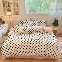 Ensemble de literie quatre pièces en polyester à pois noir classique avec housse de couette