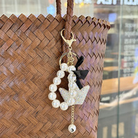 Pendentif porte-clés de luxe en forme de couronne avec perle et nœud, idéal pour téléphone, sac et clés de voiture, fabriqué en Chine