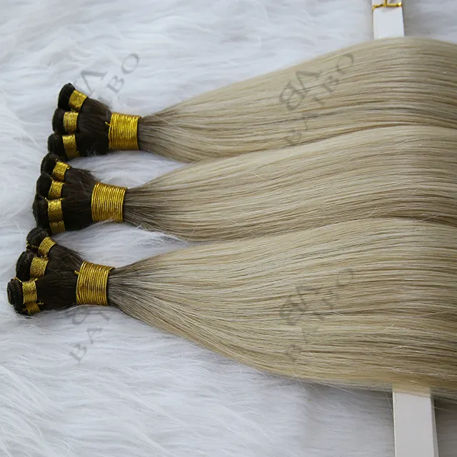 安定した品質の二重描画レミーオンブル100% ロシアの自然な人間の髪の卸売手で結ばれた横糸ヘアエクステンション