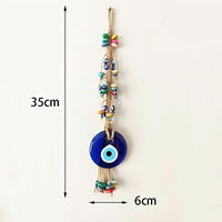 Décoration œil bleu style bohème, faite à la main avec corde en macramé de coton et perles colorées, design compact s'adaptant à tous les espaces