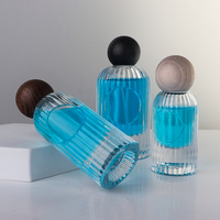 Étiquette autocollante personnalisée de luxe pour boîte cadeau rigide carrée, flacon de parfum cylindrique haut de 50 ml avec pulvérisateur à pompe à sertir et bouchon à bille en bois