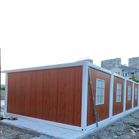 Villa Modulaire Détachable à Deux Étages, Espaces de Vie, Bureau et Terrasse Végétalisée avec Portes et Fenêtres Blanches pour Utilisation en Parc ou sur Pelouse