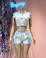 Ensemble deux pièces streetwear tendance été 2026 pour femme : crop top rayé sans manches et short slim