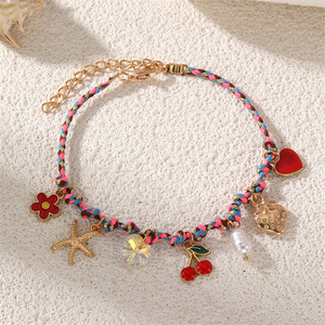 Pulsera Tejida Multicolor Hecha a Mano con Dijes de Oro de la Serie Océano: Estrella de Mar, Tortuga, Pez, Flor y Perla - Product Image 6