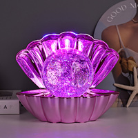 Lampe de table LED à lumière liquide changeante de couleur RGB avec un design brillant et une grande forme de coquille