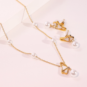 Ensemble de bijoux collier et boucles d'oreilles en acier inoxydable plaqué or 18 carats pour femmes - Bijoux tendance pour mariage et fiançailles - Product Image 1