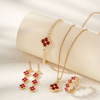 Ensemble de bijoux transfrontalier en cuivre, zircon et trèfle à quatre feuilles, style mode luxe léger, élégant et sophistiqué, comprenant bracelet, boucles d'oreilles, bague et collier