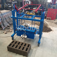 Machine manuelle à 100 % sans électricité pour la fabrication de blocs creux en béton, modèle mobile, en promotion sur le marché africain