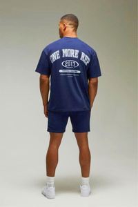 ชุดสตรีทแวร์ผ้าคอตตอนผสมโพลีเอสเตอร์สีกรมท่า เสื้อยืดโอเวอร์ไซส์ลาย One More Rep และกางเกงขาสั้น ชุดแบรนด์เนม เสื้อผ้าแทรคสูท - Product Image 3