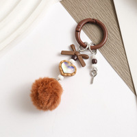 Porte-clés mignon en forme de cœur avec nœud et pompon en fourrure, breloque de sac en peluche colorée, accessoires de chaîne de téléphone pour la décoration de sac à dos