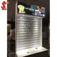 Vitrine d'exposition pour téléphones portables et tablettes avec éclairage LED, crochets pour panneaux rainurés, design écologique, construction robuste pour les magasins de détail