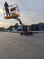 Chariot élévateur à ciseaux diesel/électrique autopropulsé à haute efficacité avec rails de sécurité, hauteur de plateforme de 10 m, portée de 16,5 m, certifié CE