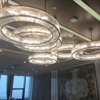 Lustre suspendu LED moderne en cristal à anneaux multiples de luxe, luminaire rond empilé pour la décoration intérieure d'hôtel