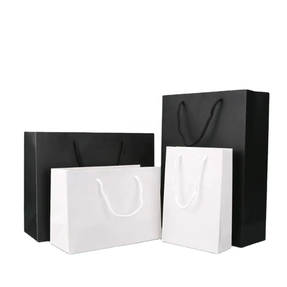 Emballage cadeau promotionnel sac en papier pour courses logo personnalisé petit fourre-tout de luxe pour vêtements bijoux Art noir blanc papier kraft accepté