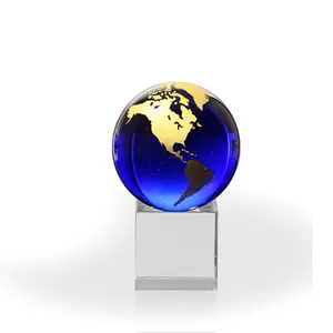 Glowing blue optical crystal globe appreciation continents etched with optional elegant global