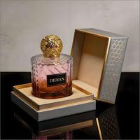 Nouvelle conception de flacon de parfum vide en verre transparent rond de luxe, unique, 50 ml, 100 ml, flacon de parfum pour femmes avec bouchon argenté ou doré