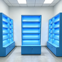 Étagère de présentation moderne avec rétroéclairage LED bleu, vitrine multi-niveaux avec base verrouillable pour produits de tabac/produits pharmaceutiques