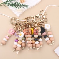 Schmuck-Schlüsselanhänger mit individuellem Logo, Silikon-Blumenperlen, PU-Leder-Armband und elastischem Schlüsselring
