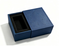 Boîte cadeau rigide à tiroir coulissant de luxe, surface à motif de feuilles en relief, insert en mousse EVA noire personnalisé pour l'emballage de parfums et de cosmétiques