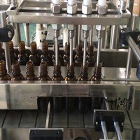 Máquina de llenado y tapado de líquidos en espray de perfume