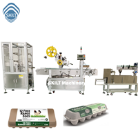 Machine d'étiquetage industrielle à grande vitesse pour cartons d'œufs, ligne de production entièrement automatique pour l'étiquetage et le codage des barquettes d'œufs en pulpe plastique