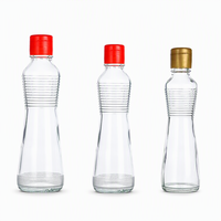 Bouteille en verre transparent pour huile et vinaigre avec bouchon métallique hermétique, idéale pour les assaisonnements et sauces de cuisine (vente en gros)