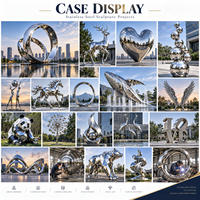 Sculpture de galets en acier inoxydable poli miroir sur mesure pour les jardins d'hôtels, les parcs de bureaux, les installations aquatiques et les places publiques
