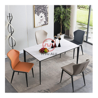 Ensemble de table à manger 8 places en aluminium antique de style moderne simple et stable avec grand espace et table à manger en marbre noir