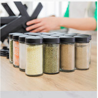 Fournitures de cuisine support d'assaisonnement rotatif pot d'assaisonnement domestique boîte de rangement d'épices en fer inoxydable ensemble multi-spécifications