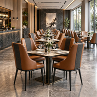 Fauteuil de salle à manger en cuir avec dossier haut, revêtement cognac, structure en métal noir, mobilier de restaurant, personnalisable, OEM, vente en gros, Chine
