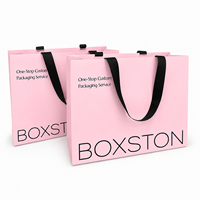 Sacs shopping en papier de luxe avec logo personnalisé et poignées pour l'emballage de vêtements, sacs cadeaux en gros