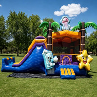 Château gonflable commercial sur le thème de l'océan avec toboggan et palmiers pour la location de fêtes d'enfants