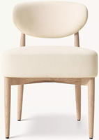 Chaise de salle à manger en chêne massif, style tubulaire moderne, avec pieds coniques élancés de style sculptural et assise rembourrée en tissu moelleux