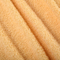 Haute qualité automne hiver vêtements de détente velours 100% Polyester uni teint Teddy polaire tissu pour pyjamas vêtements jouets oreillers