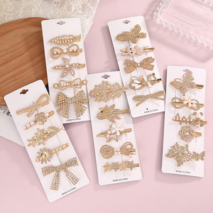 Juego de pinzas para el cabello estilo coreano con perlas y diamantes de imitación, pinza lateral con diseño de mariposa, corazón y lazo, accesorio para el cabello de uso diario, hecho en China. - Product Image 1
